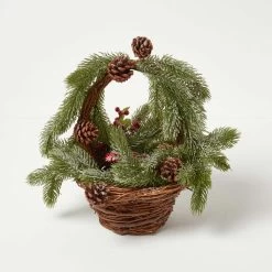 Festive Wicker Basket Christmas Decoration With Green Fir, Berries And Pinecones